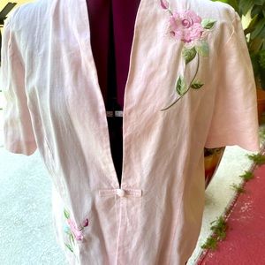 Pink short sleeve jacket with embroidered roses on the front